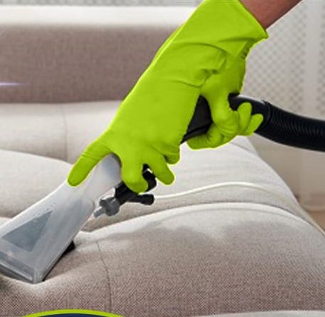 Couch upholstery being cleaned with an upholstery tool